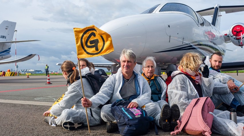 Foto (c) Greenpeace/Marten van Dijl Klimaatprotest Schiphol