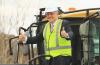 Scott Morrison vanuit een bulldozer